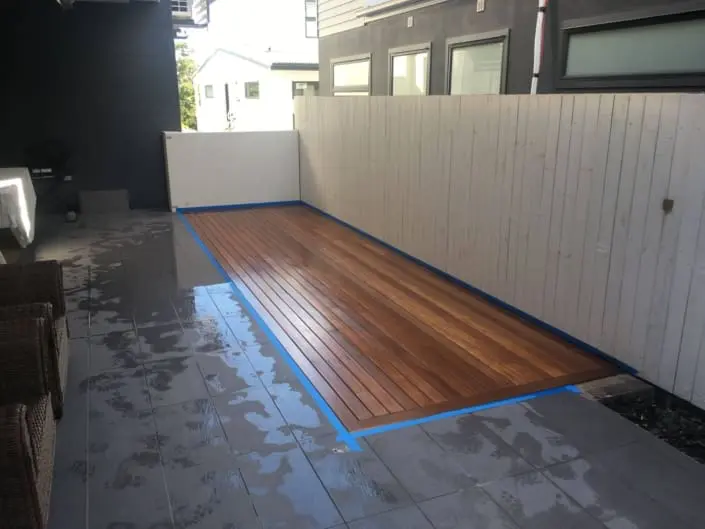 Timber boards installed flush around existing tiles