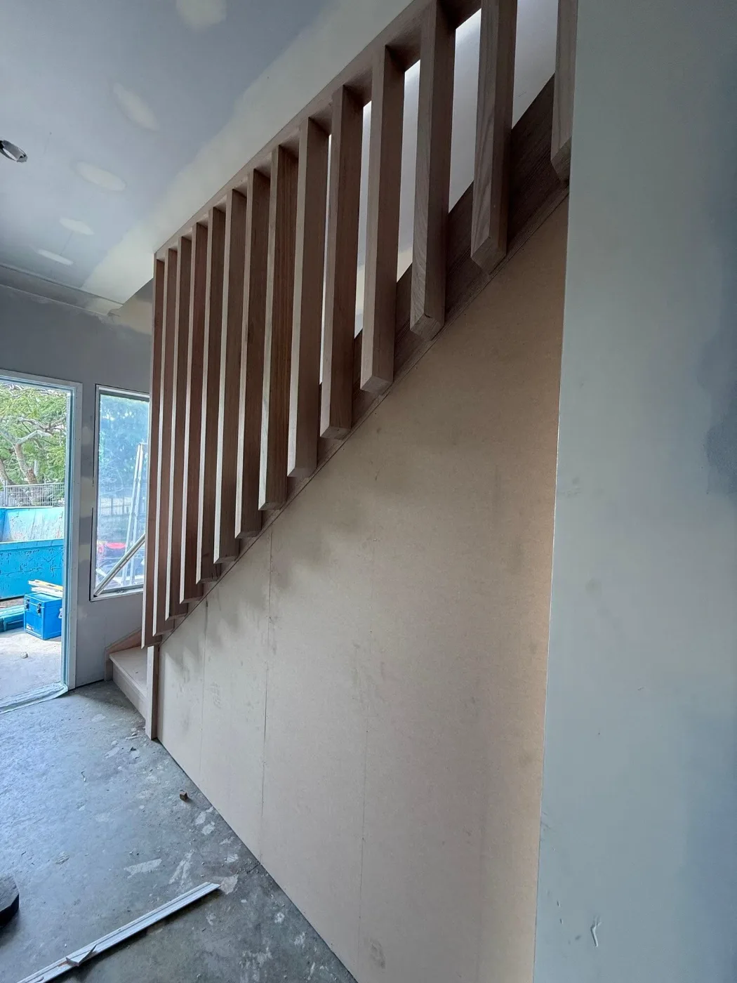 Timber slat balustrade above a new staircase before painting, Brisbane home renovation