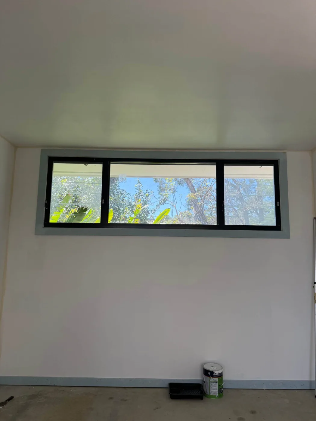 New aluminium window installed and lining painted in a Brisbane home renovation
