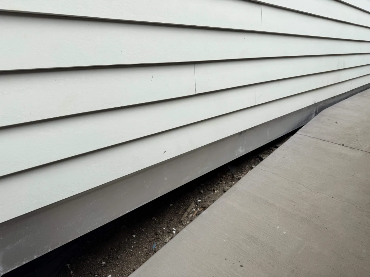 Steel beam retrofitted beneath wall cladding on a Brisbane home