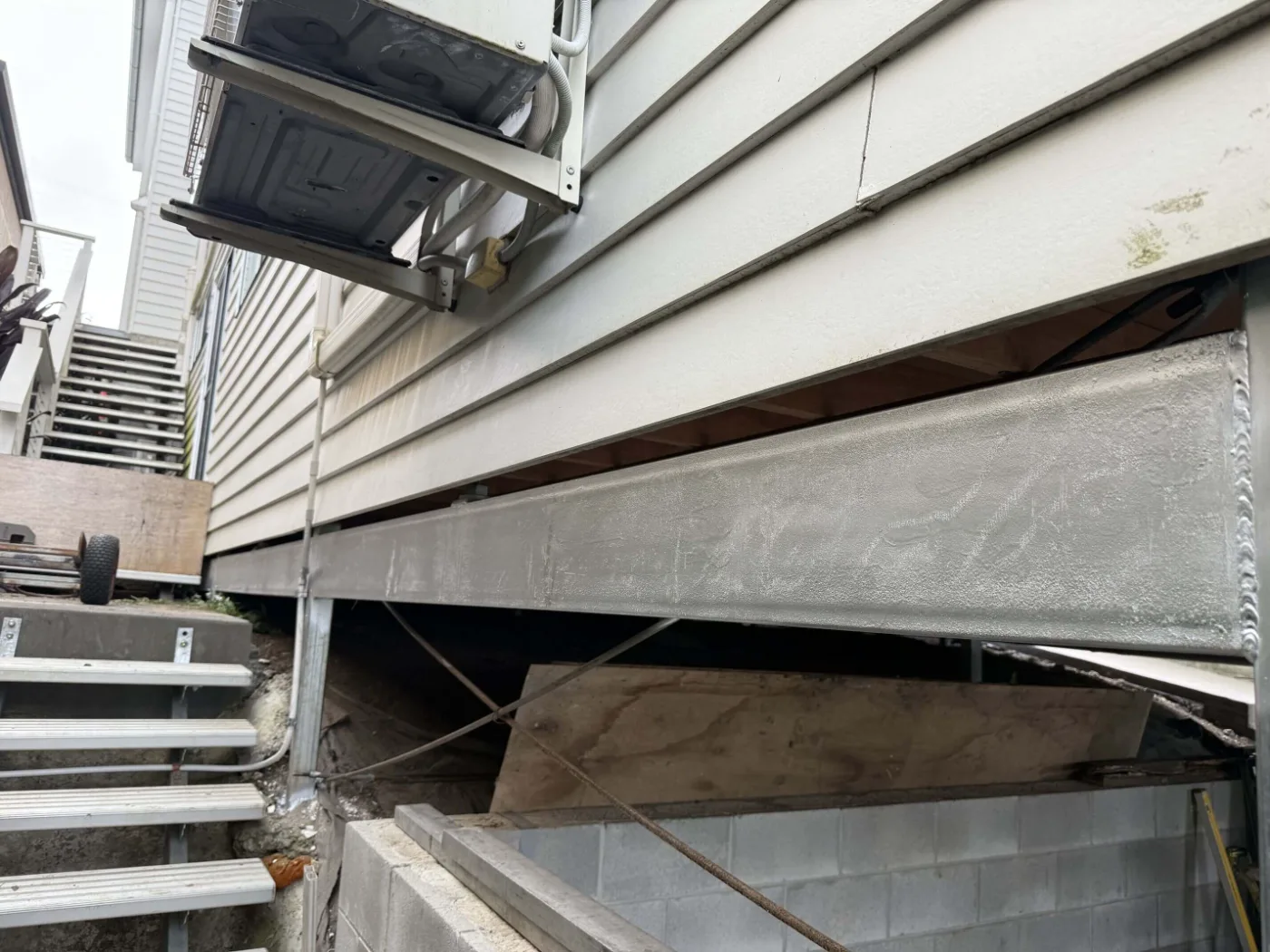 New galvanised steel bearer supporting a Brisbane home during restumping works