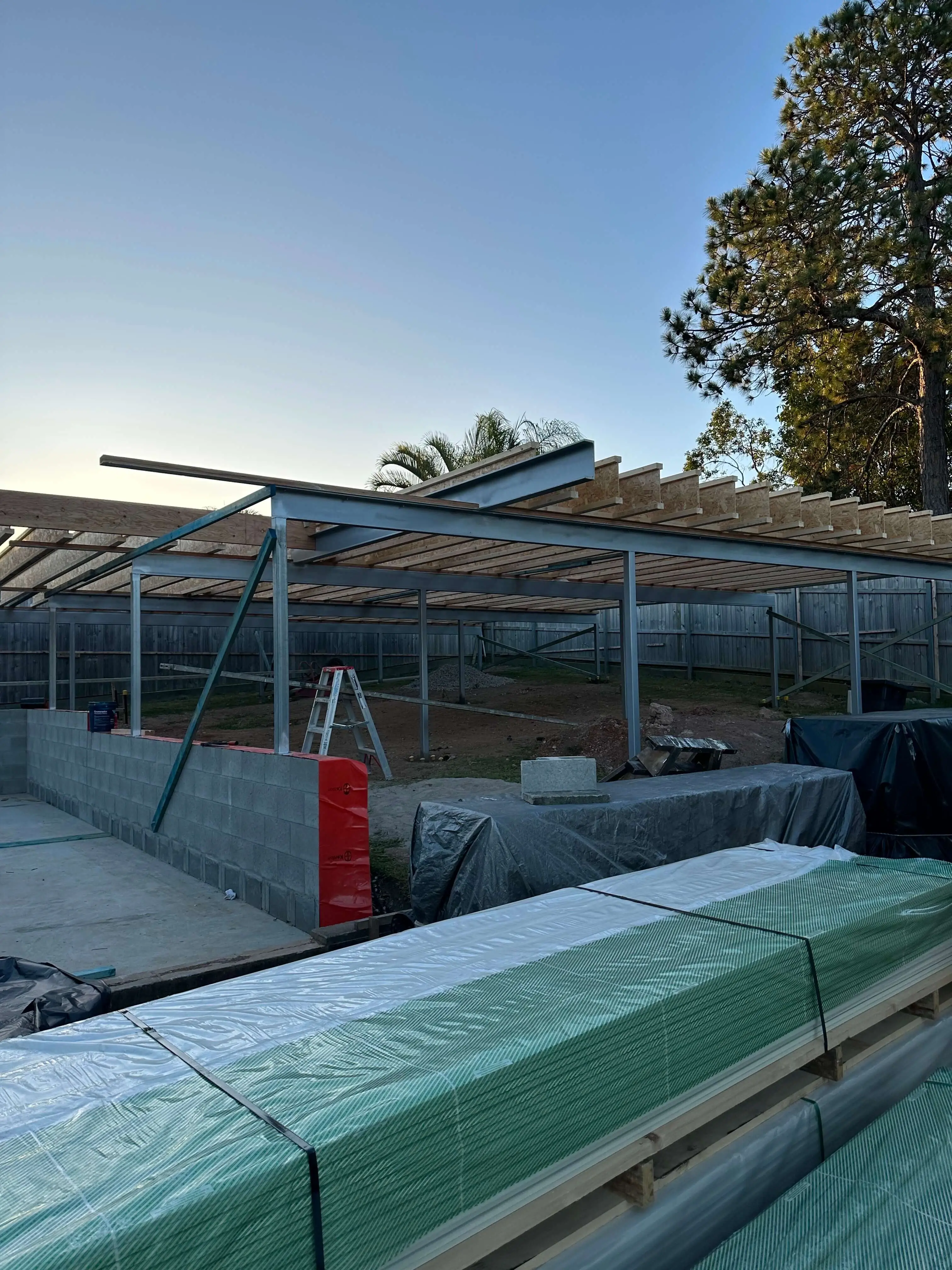 Galvanised steel carport frame with timber rafters under construction in Brisbane
